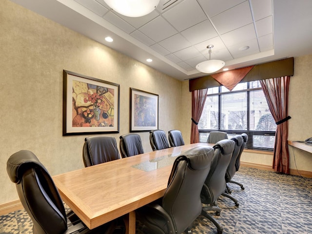 carpeted office with a tray ceiling, recessed lighting, baseboards, and a drop ceiling