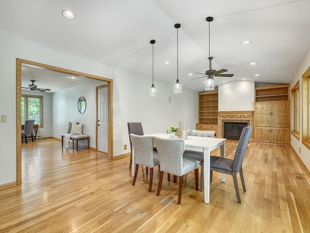 5109 Richmond Dr, Edina, MN 55436 - dining space with a ceiling fan, vaulted ceiling, light wood-type flooring, a glass covered fireplace, and recessed lighting