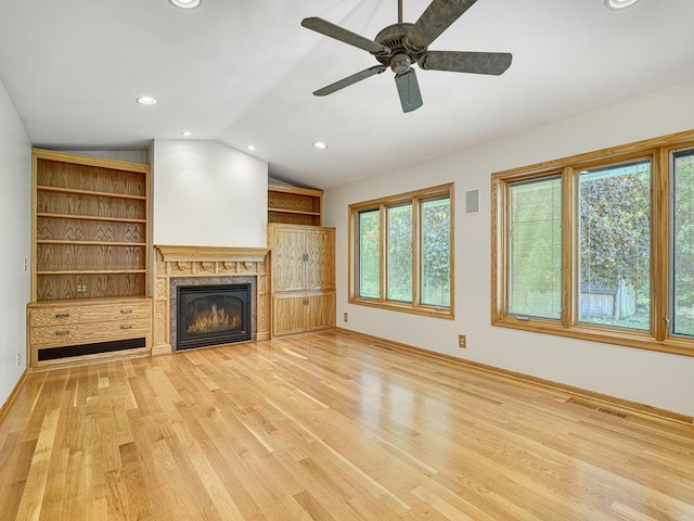5109 Richmond Dr, Edina, MN 55436 - unfurnished living room featuring lofted ceiling, light wood-style floors, a glass covered fireplace, baseboards, and ceiling fan