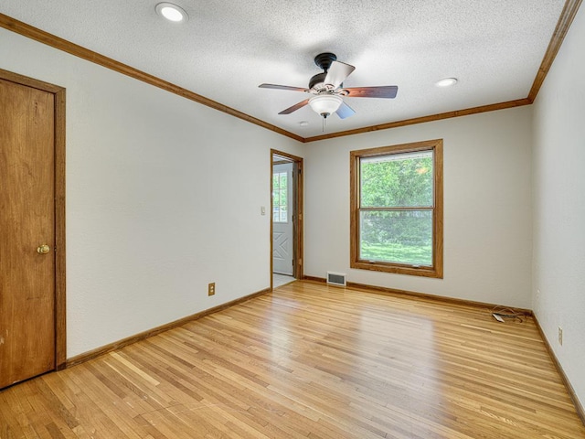 5109 Richmond Dr, Edina, MN 55436 - spare room with light wood-type flooring, a textured ceiling, crown molding, a ceiling fan, and baseboards