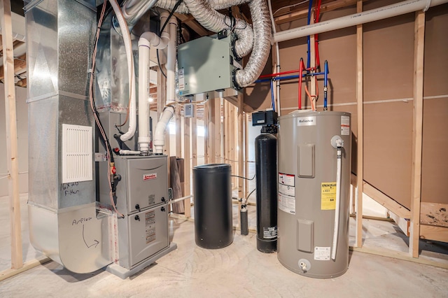 utility room featuring water heater and heating unit