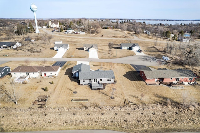 bird's eye view with a water view and a residential view