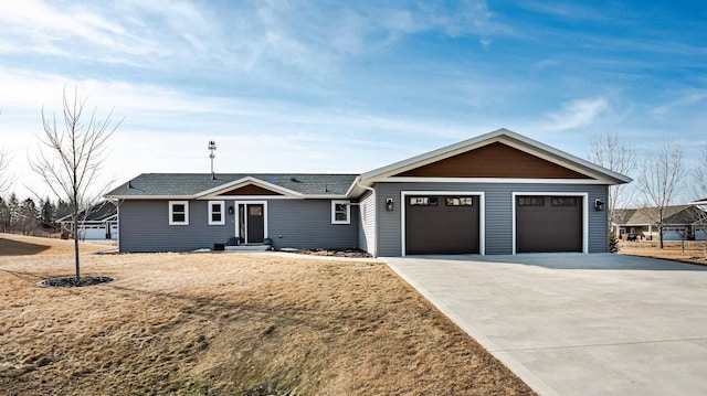 ranch-style home with driveway, a shingled roof, and a garage