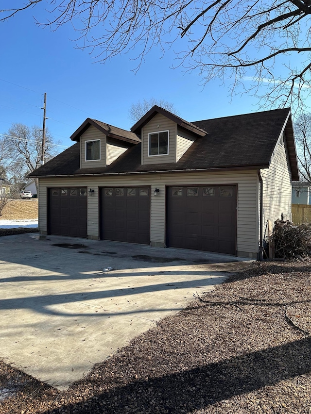 exterior space featuring concrete driveway