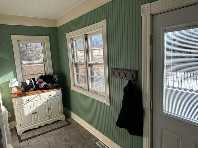 entryway featuring tile patterned floors, visible vents, and baseboards