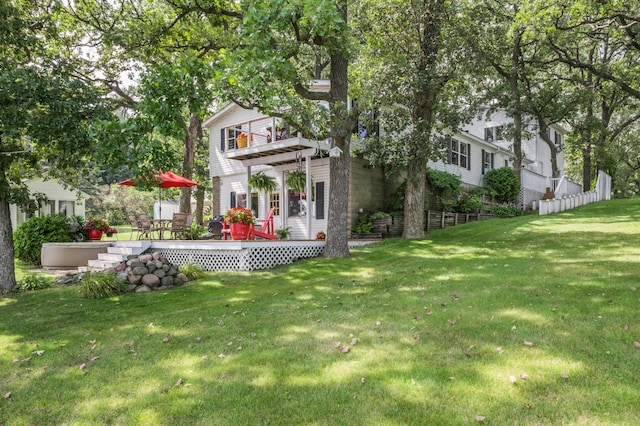 view of yard featuring a wooden deck