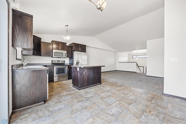 kitchen with a sink, open floor plan, stainless steel appliances, dark brown cabinetry, and lofted ceiling