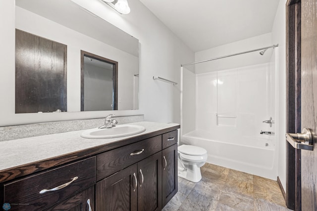 full bath with vanity, shower / tub combination, and toilet