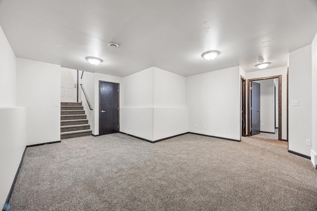 finished basement featuring baseboards, carpet floors, and stairs