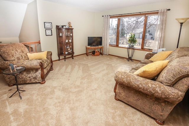 carpeted living room featuring baseboards