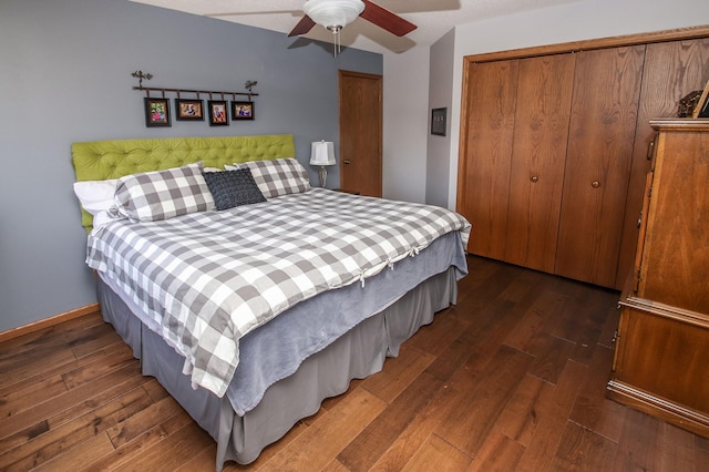 bedroom featuring baseboards, ceiling fan, and hardwood / wood-style floors