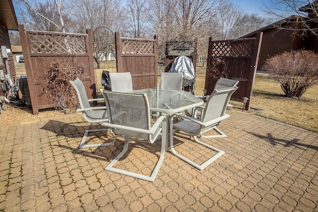 view of patio / terrace with outdoor dining area and fence