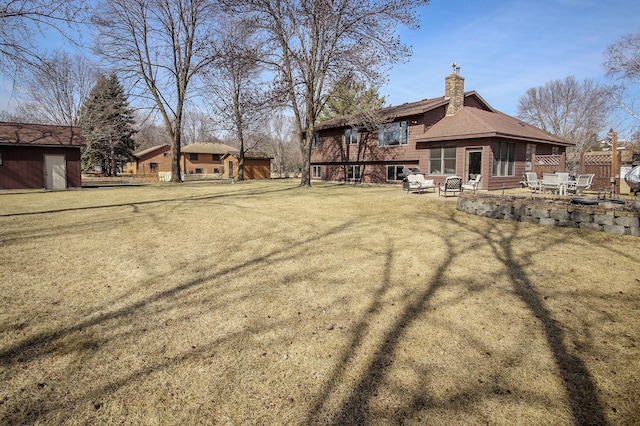 view of yard with a patio and fence