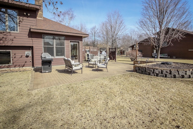 view of yard featuring an outdoor fire pit and a patio