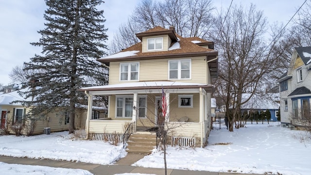 american foursquare style home with a porch