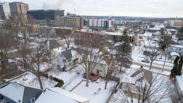 snowy aerial view with a view of city