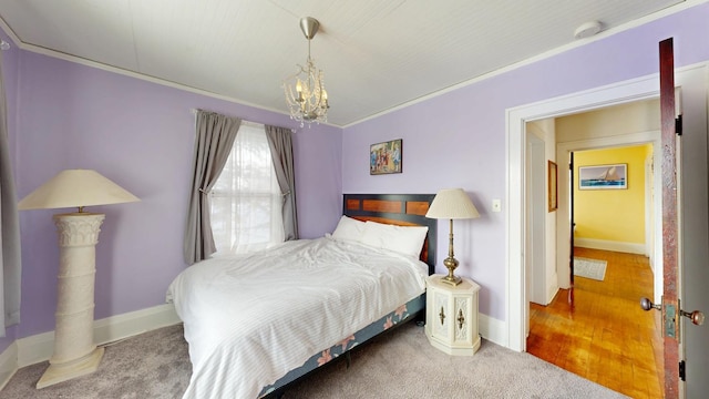 bedroom with a chandelier, baseboards, and ornamental molding