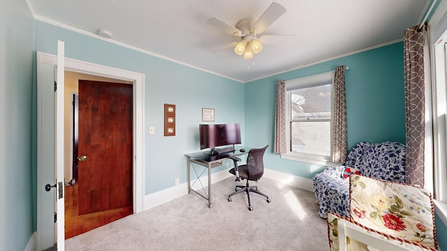 office space with baseboards, a ceiling fan, carpet, and ornamental molding