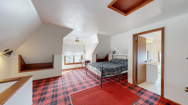carpeted bedroom with lofted ceiling