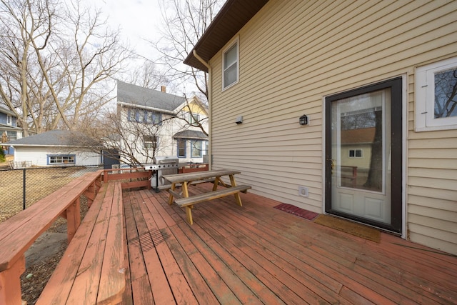 wooden deck featuring outdoor dining area and grilling area