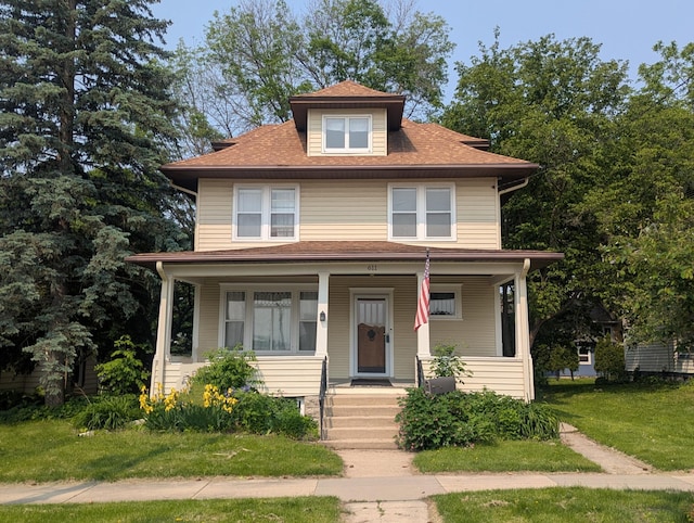 611 5th Ave SW, Rochester, MN 55902 - traditional style home with a porch, a front lawn, and a shingled roof
