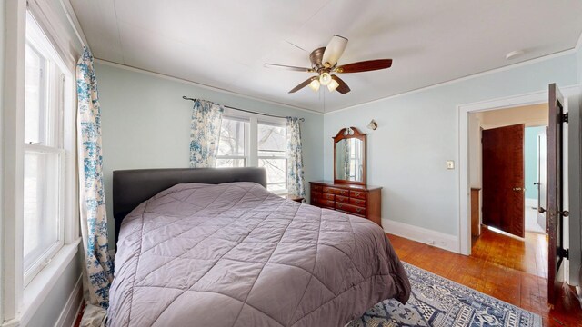 611 5th Ave SW, Rochester, MN 55902 - bedroom with hardwood / wood-style floors, ornamental molding, baseboards, and ceiling fan