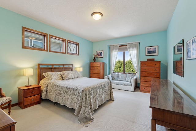 carpeted bedroom with a textured ceiling