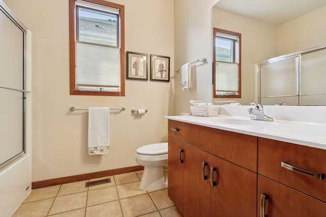 full bath featuring vanity, baseboards, visible vents, tile patterned floors, and toilet