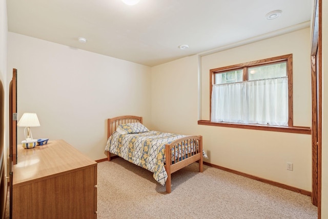 carpeted bedroom with baseboards