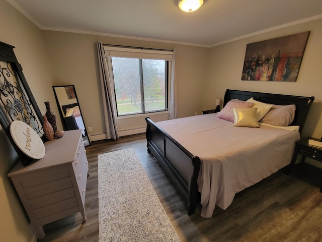 bedroom featuring dark wood-style flooring, a baseboard radiator, a baseboard heating unit, and ornamental molding