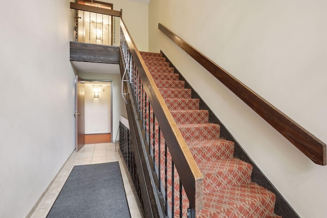 stairs featuring tile patterned floors