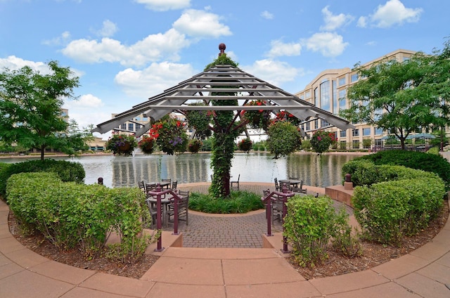 view of patio featuring a gazebo and a water view