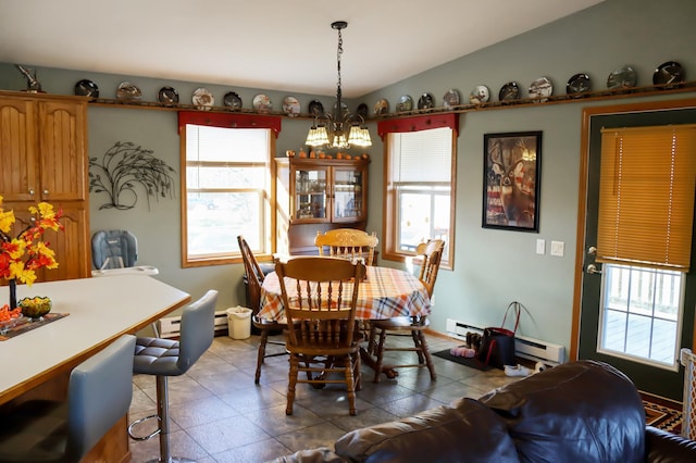 dining space featuring light tile patterned floors, a baseboard radiator, and vaulted ceiling