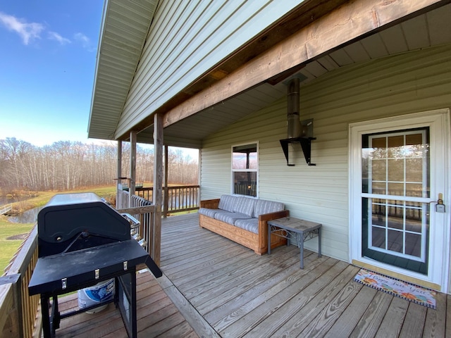 wooden terrace featuring area for grilling