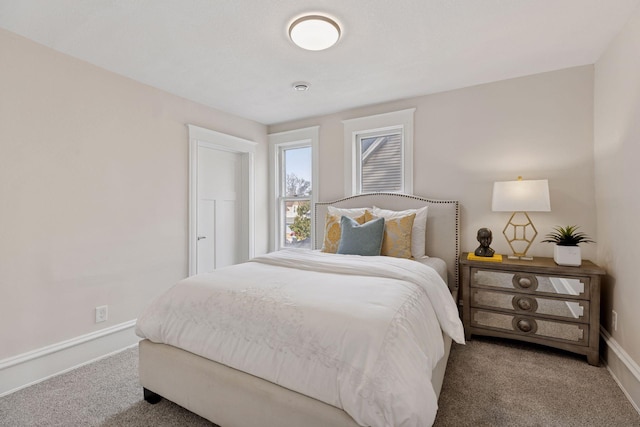 bedroom featuring carpet flooring and baseboards