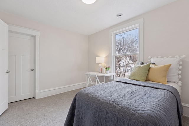 bedroom featuring baseboards and carpet floors