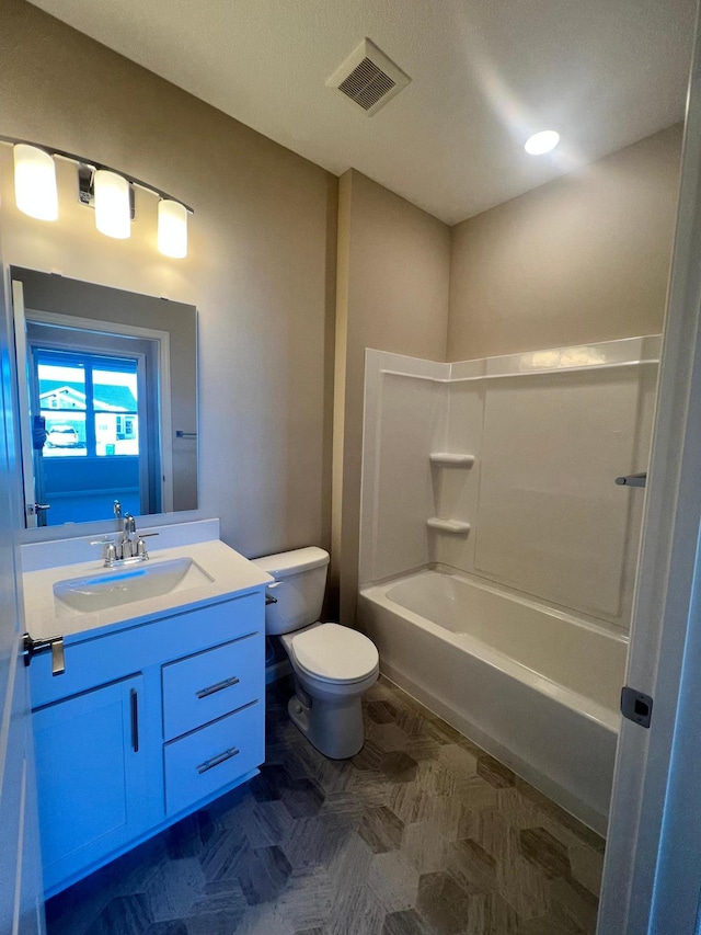 full bath with vanity, toilet, tub / shower combination, and visible vents