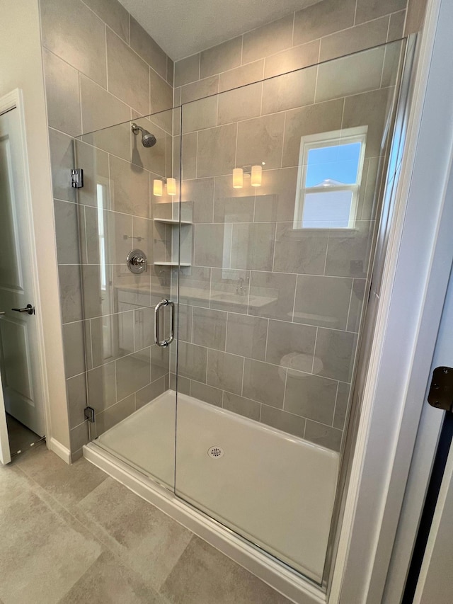 bathroom with a shower stall