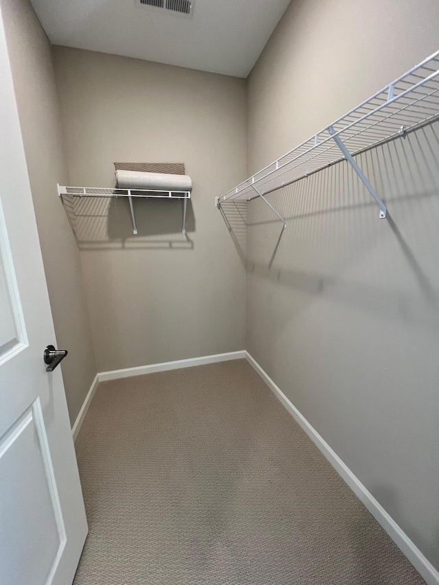 walk in closet with carpet and visible vents