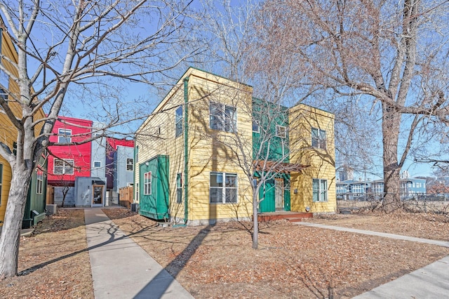 townhome / multi-family property with fence and central AC