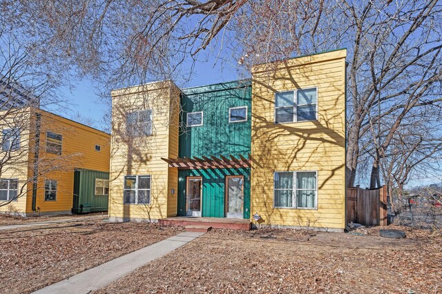 view of front of house featuring fence