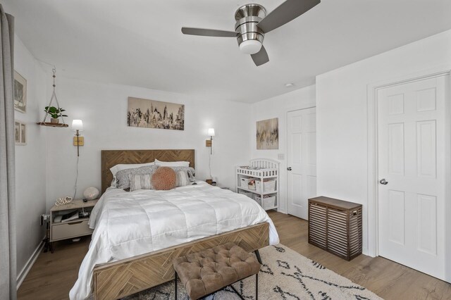 bedroom with a ceiling fan and wood finished floors