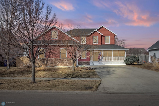 traditional-style home with concrete driveway