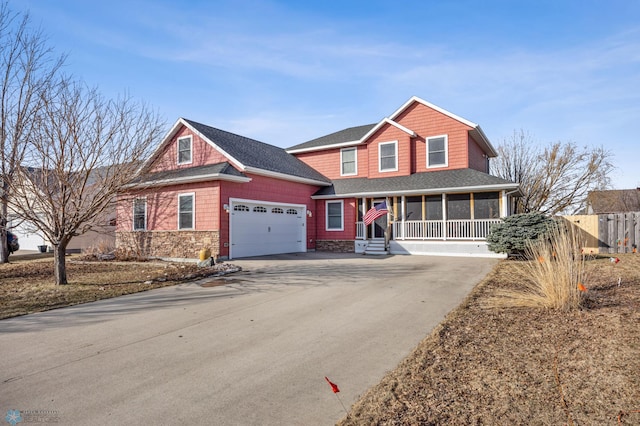 view of front of house featuring a garage, roof with shingles, concrete driveway, and fence