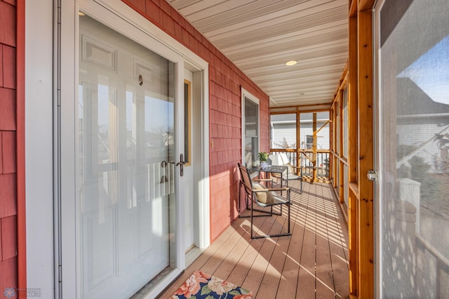 sunroom featuring wood ceiling