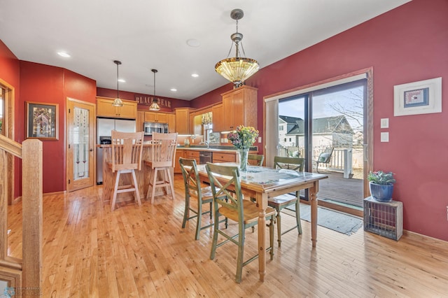 dining room featuring recessed lighting and light wood-type flooring