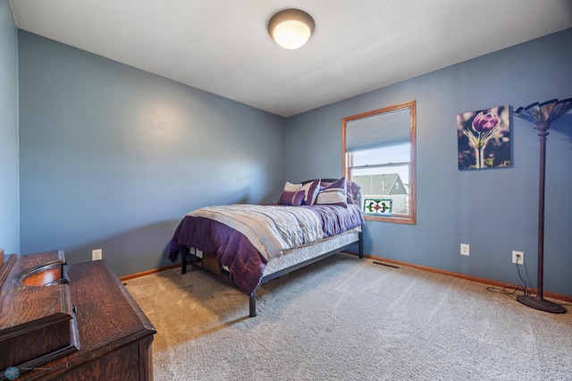 bedroom with visible vents, baseboards, and carpet flooring