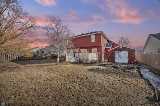 back of property with a fenced backyard