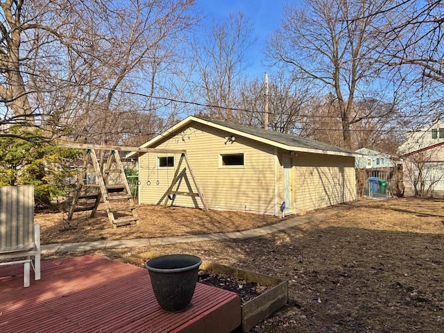 view of outbuilding featuring an outbuilding and fence