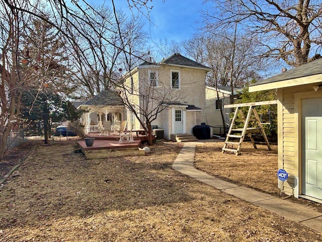 back of house featuring entry steps